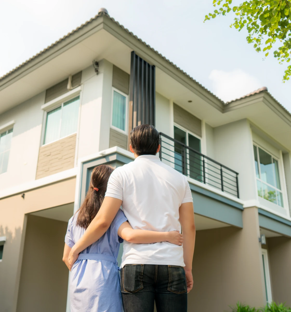 Couple admiring a modern house