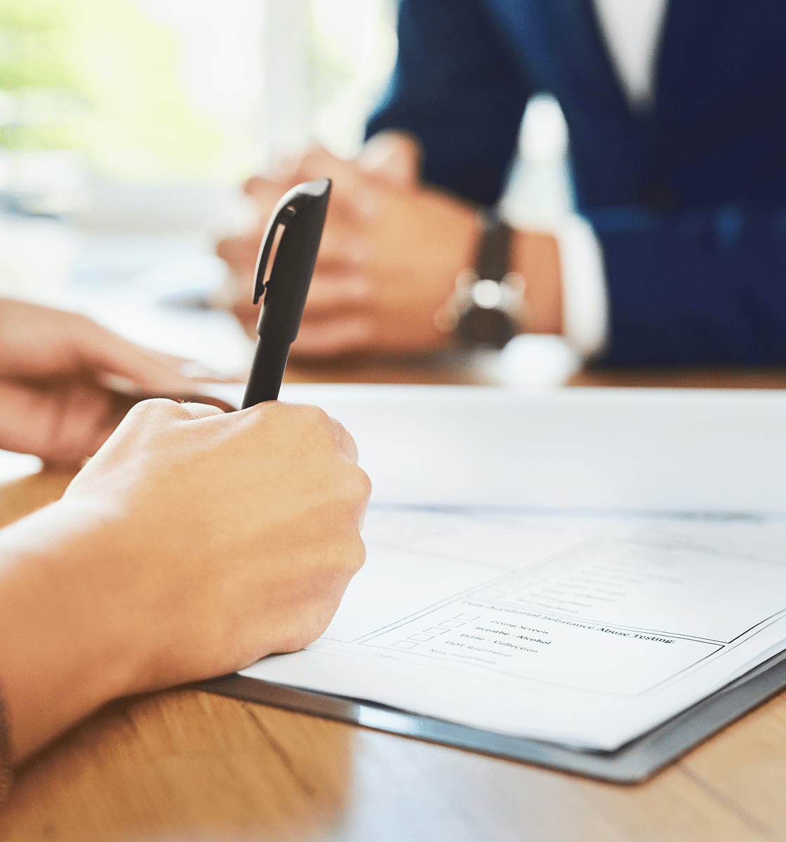 Business meeting with paperwork and pen