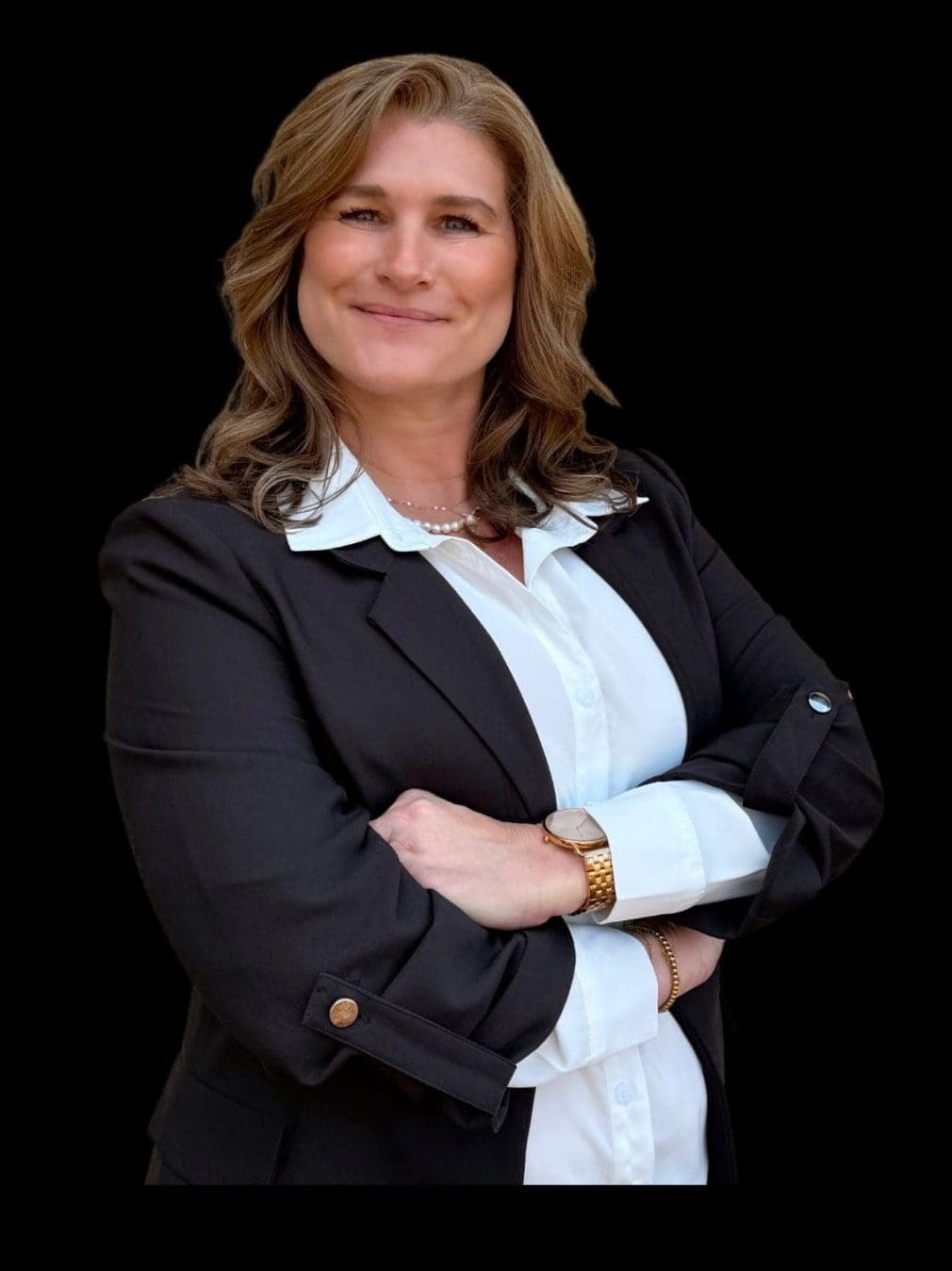 Confident woman in business attire with arms crossed.